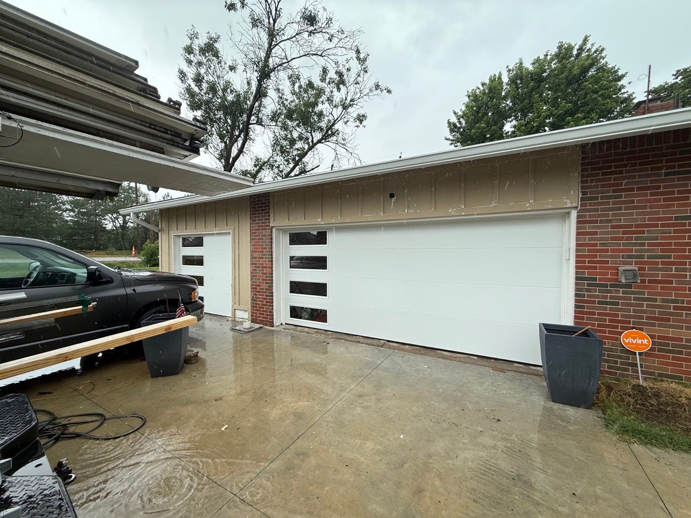 After: new white modern garage doors with windows