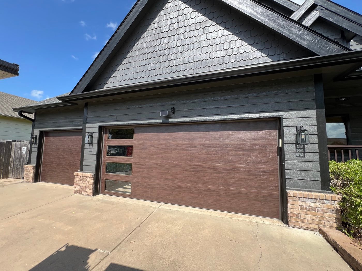 Brown modern garage door with frosted side windows